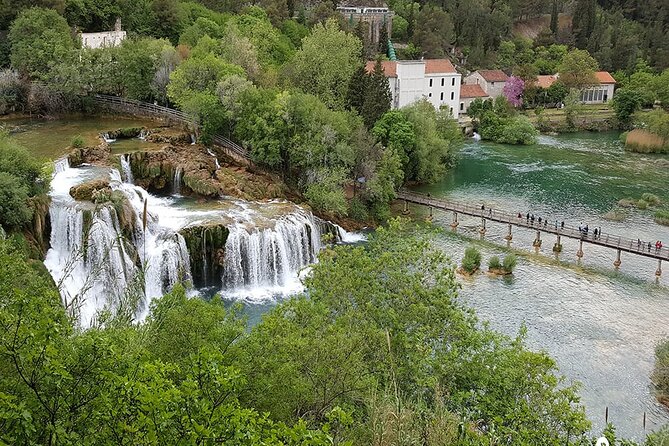 Private Krka Waterfalls with Wine and Prosciutto Shore Excursion - Sladic Winery and a family table