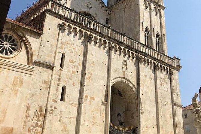 Split and Trogir private tour <em>ideal for cruise ship guests</em> – Two ancient cities, one sensible half-day’ /></p>
<p><p>The clever idea here is simple: visit Split and Trogir together instead of treating them as separate day trips. They are close enough to combine, yet different enough to keep the day interesting. Split feels like a living city built around an imperial palace. Trogir feels smaller and more concentrated, with its cathedral, narrow lanes, and compact old center.</p>
</p>
<p><p>You get five hours from pickup in Split to your return there. The day includes about an hour of guided time in Trogir, an hour to explore on your own, about 90 minutes with a guide in Split, and another hour of free time. That balance matters. You receive context from a local professional, then get room to look around without someone talking every minute.</p>
</p>
<p><p>This is especially useful if you arrive by cruise ship. Pickup takes place outside the cruise customs area, where the guide waits with a sign bearing your name. You will want to allow a little time to leave the ship and clear the required area, but the private setup avoids the uncertainty of finding a large coach or gathering point.</p>
</p>
<p><p>The tour costs $235 per person. That is not a bargain-priced sightseeing outing, but the comparison should be with a private vehicle, a licensed guide, cruise-port pickup, and two cities in one outing. For a small private group, the value improves. If you are a solo visitor or a couple watching every dollar, a shared tour may cost less. If you want control over the pace and a direct return to your ship, the price is easier to justify.</p>
</p>
<h2>Starting in Trogir, where the stonework is close at hand</h2>
<p><img width="900" height="506" decoding="async" src=